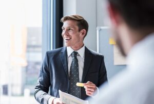 imgi 112 smiling businessman in a meeting in office royalty free image 1627015681